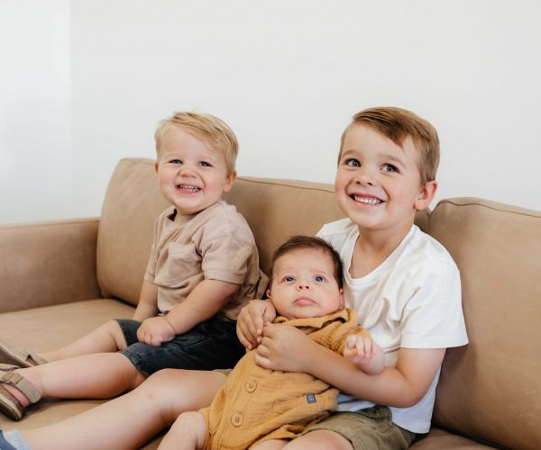 adorable kids sitting on the couch